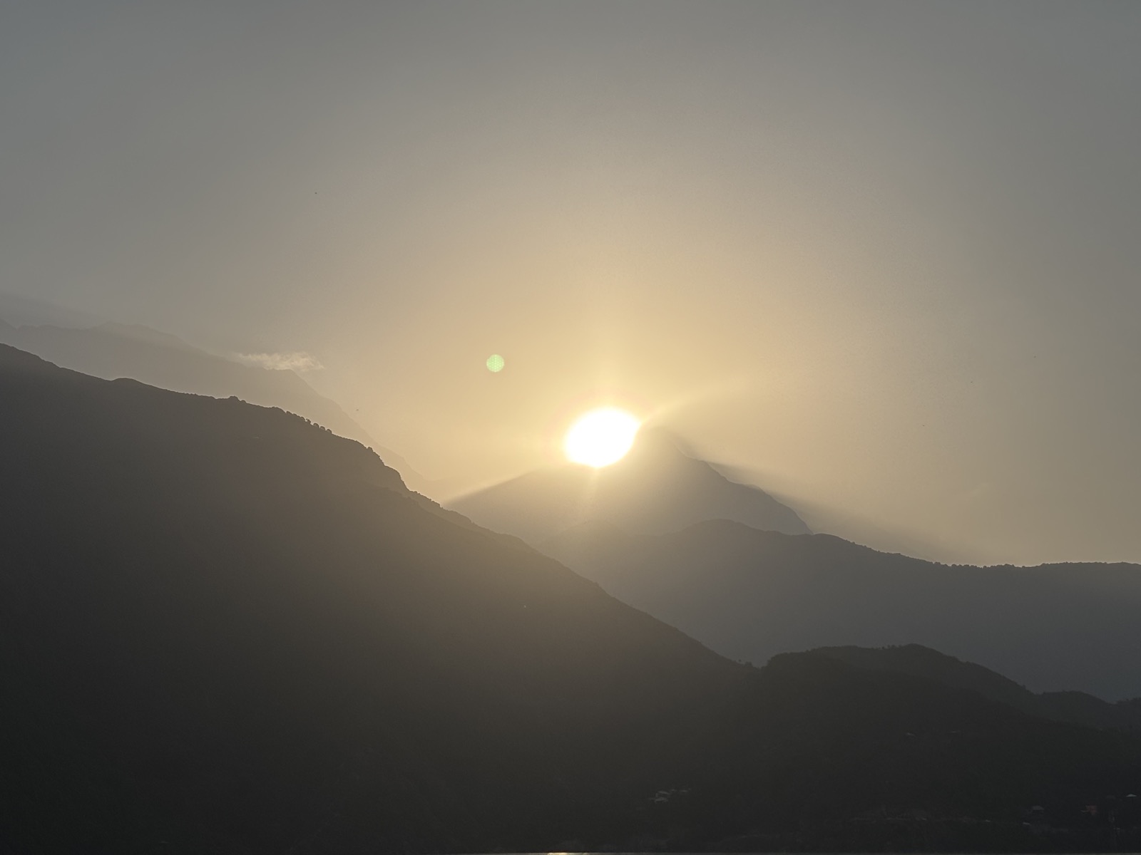 Sunrise behind mountain peaks in Himachal