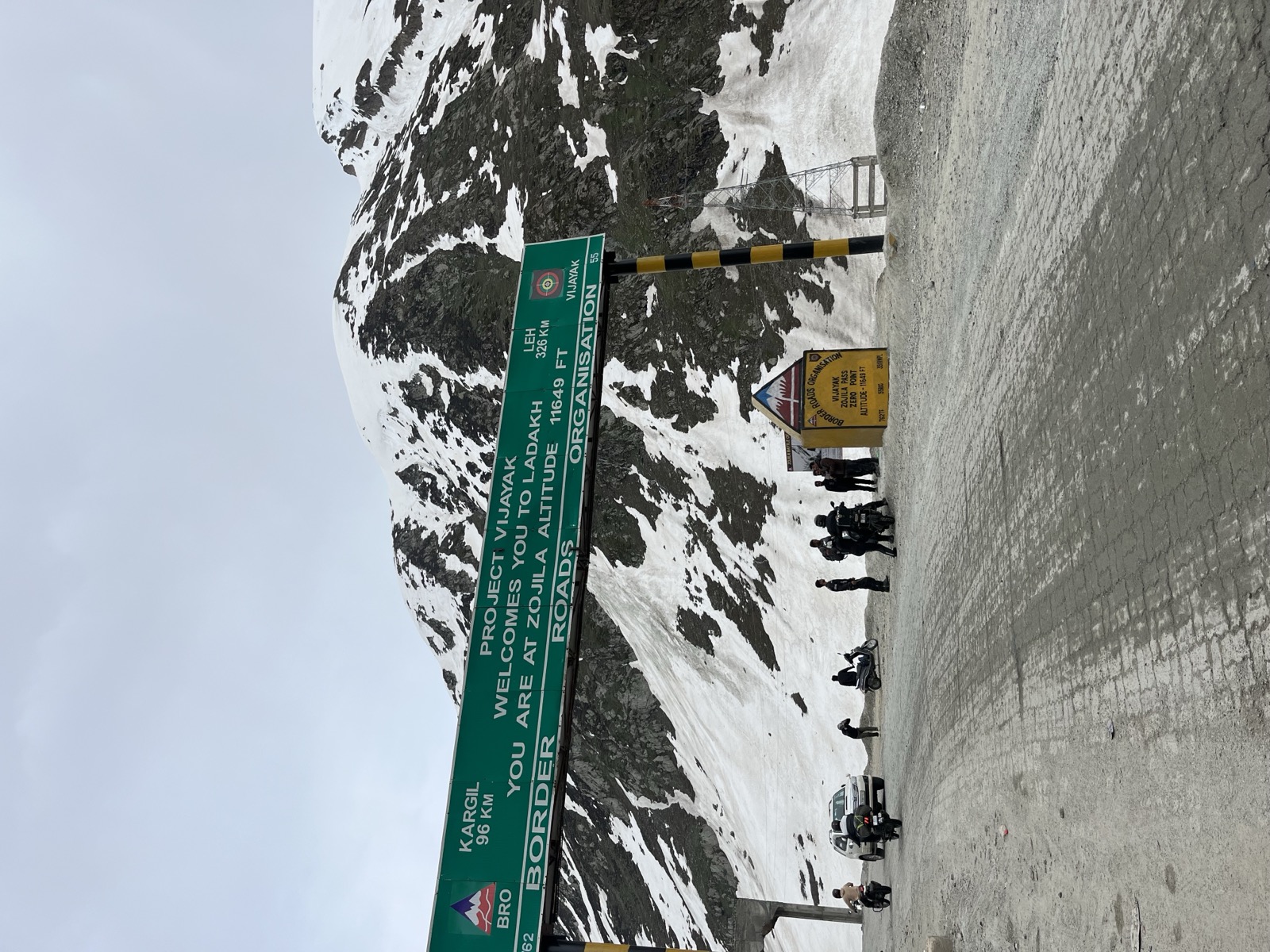 Motorcycle rider with snow-capped mountains in Ladakh
