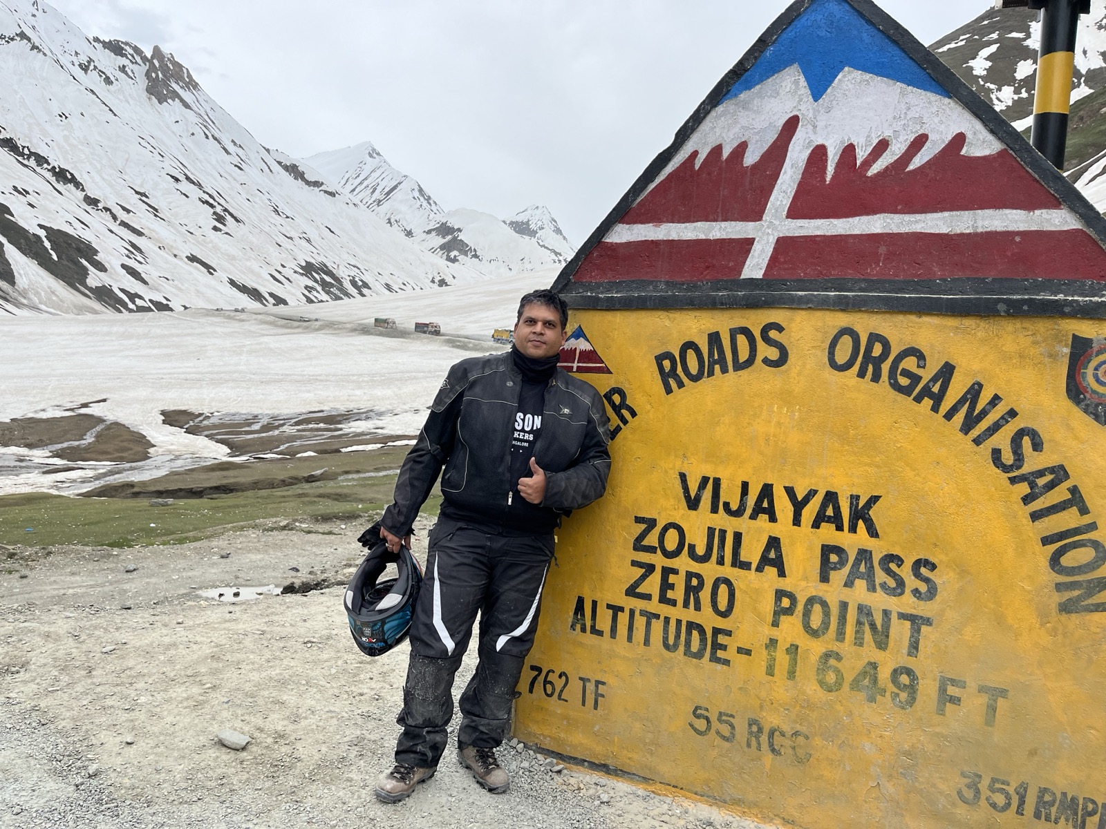 Zojila Pass milestone sign in snow
